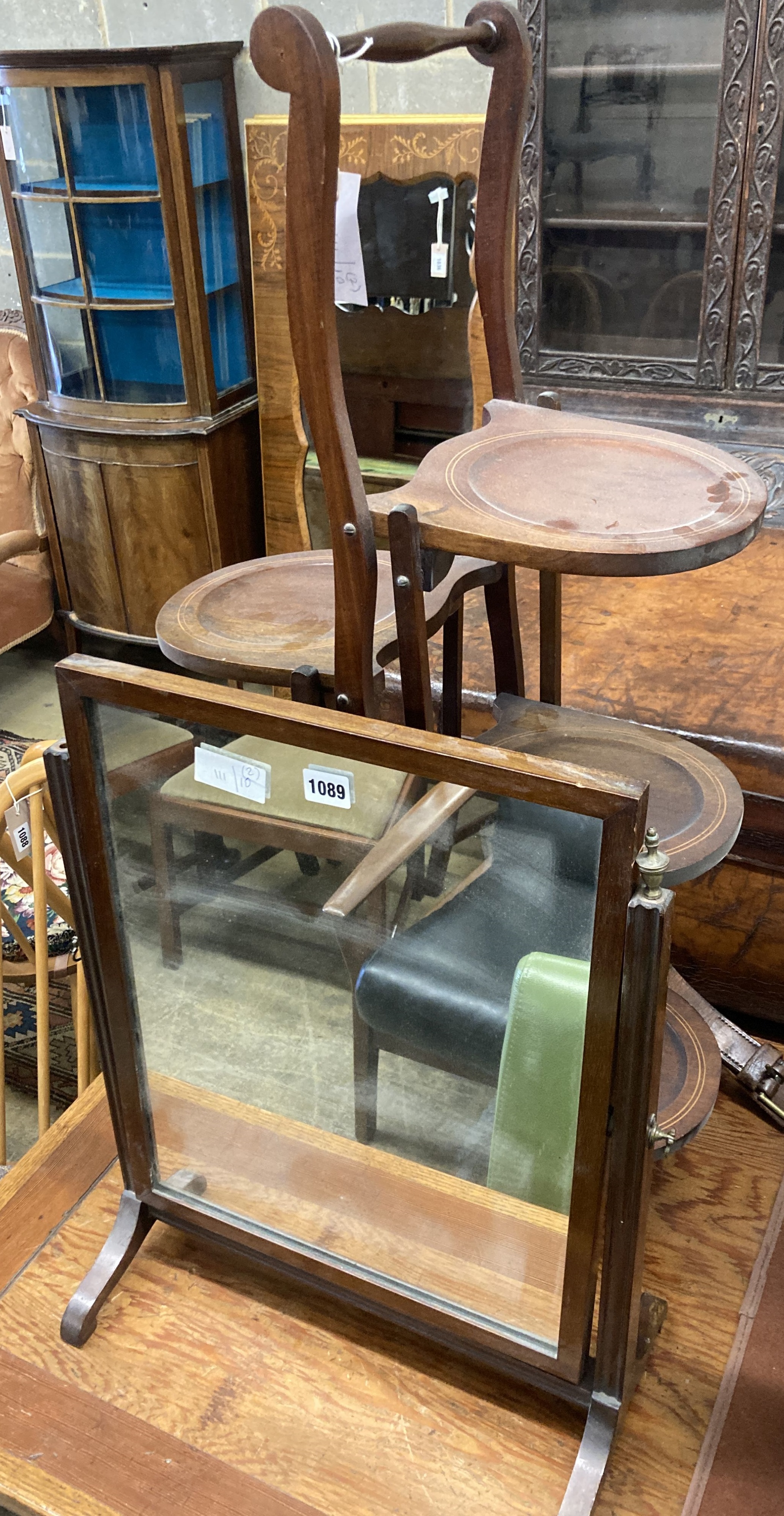 An Edwardian mahogany folding cake stand together with a mahogany toilet mirror